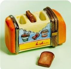 a toaster with two pieces of bread in front of it