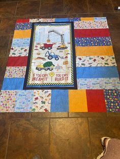 a child's play mat on the floor with a quilt saying if you can read it, you can repair it