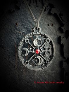 This Sigil of Decarabia necklace is an handmade pewter sculpture with a gem of your choice (my favorite is the red abalone, if you are looking for a very nice bloody red) This seal of Decarabia is one of the 72 Sigils of Goetia from Ars Goetia's Demonology This Sigil of Goetia pendant is sold with a free 18'' stainless steel chain, if you would like to have a different length for the chain, you can write the desired length in the private note section when ordering :) This Seal of Decarabia is a Round Pewter Jewelry As Gift, Nickel Free Symbolic Jewelry For Ceremonial Occasions, Nickel Free Pewter Jewelry For Collectors, Round Pewter Jewelry Gift, Symbolic Ceremonial Jewelry Nickel Free, Symbolic Jewelry With Oxidized Finish For Festivals, Spiritual Silver Jewelry In Pewter, Silver Gothic Jewelry For Ceremonial Occasions, Silver Handcrafted Symbolic Jewelry