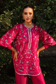 We continue to infuse extra love in effortless ensembles that become perfect partners for your casual and formal gatherings. The cherry pink pure rawsilk shirt is adorned with delicate floral embroidery taking the mood from pretty to playful with its exaggerated cuff sleeves and pure rawsilk trousers with an embroidere Spring Pink Kurta With Embroidered Sleeves, Elegant Pink Summer Kurta, Spring Pink Cotton Silk Sets, Pink Traditional Sets With Embroidered Sleeves, Traditional Pink Sets With Embroidered Sleeves, Festive Feminine Sets With Resham Embroidery, Feminine Resham Embroidery Sets For Festive Occasions, Pink Cotton Silk Party Sets, Pink Sets With Embroidered Sleeves For Wedding