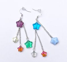 Handmade star dangle earrings, attached to silver chain and silver plated hooks.  Multicoloured glass star beads.  Fun, celestial style, y2k, chic, boho, cottagecore, space, astrology Y2k Chic, Celestial Style, Cute Dangle Earrings, Star Celestial, Star Dangle Earrings, Bubble Wrap Packaging, Celestial Earrings, Star Beads, Silk Bag