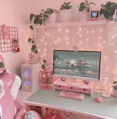 a pink desk with a computer on it