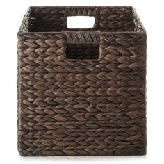 a large brown basket with handles on the sides and an opening at the top for storage