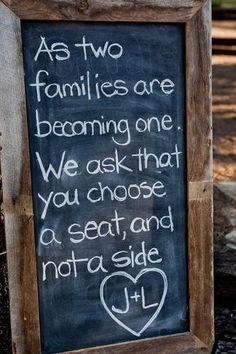 a chalkboard sign with the words as two families are becoming one we ask that you choose a seat and not a side