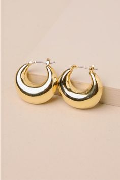 The options for styling the Lulus Timeless Darling Gold Puffy Hoop Earrings are practically endless! Shiny, gold-toned metal shapes these essential earrings that have a rounded, puffy silhouette and a smooth surface with a chic faceted edge, all for a finishing touch you'll find yourself reaching for again and again! Clicker clasps. 1. 25" in diameter. 100% Brass. Imported. Lulus | Timeless Darling Gold Puffy Hoop Earrings. Chunky Earrings, Casual Wedding Dress, Jewelry Lookbook, Again And Again, Find Yourself, Accessories Jewelry Earrings, Gold Tone Metal, Hinges, Gold Earrings