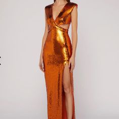 Long Dress With V-Neck At The Front And Back, Characterized By A Particular Interwoven Bodice With Small Holes On The Hips. Special Features Of The Garment Are The All-Over Embroidered Sequins, Which Create An Elegant Play Of Light And Shadow. The Textured Shoulders And Sensual Slit Decorate The Dress. The Style Is That Of The Party Or A Ceremony. Sku:73ajo486n0158511 Materials And Care Made Entirely In Italy. Composition: 90%Polyester, 10%Elastam. Dry Clean In A Specialist Center. Size 40 Itali Phoenix Inspired Gown, Copper Sequin Dress, Nye Dress, Sequin Formal Dress, Glam Dresses, Silver Dress, Orange Dress, Light And Shadow, Sequin Dress