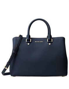 A sophisticated and stunning example of workweek-chic, structured satchel flaunts a matte finish in signature saffiano leather. Exceptionally organized, you'll find a several pockets as well as a sturdy zip compartment and convenient key holder inside.4-1/2"L double handles; 21"-24"L adjustable strapMagnetic snap closureExterior features gleaming hardwareInterior features center zip compartment, 3 open pockets, 1 zip pocket, 1 cellphone pocket and key holderMedium sized handbag: 14" W x 10" H x Affordable Handbags, Real Leather Bags, Ladies Bags, Bags Michael Kors, Classic Handbags, Cheap Handbags, Top Handle Bags, Handbags And Purses, Satchel Purse