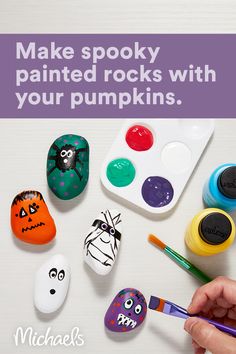 someone is painting rocks with their pumpkins