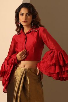 Viva magenta full layered ruffle sleeve blouse with hand embroidered collar.
Components: 1
Pattern: Placement Hand Embroidery
Type Of Work: Leaf Vine
Neckline: Collared Neck
Sleeve Type: Ruffle Sleeves
Fabric: Heavy Weight Chanderi
Color: Red
Other Details: 
Model height: 5ft 6inches, wearing size S
Note: The saree worn by the model is not for sale
Occasion: Sangeet - Aza Fashions Full Sleeves Blouse Designs, Embroidery Leaf, Full Sleeve Blouse, Viva Magenta, Simple Blouse, Embroidered Collars, Ruffle Sleeve Blouse, Durga Puja, Blouse For Women