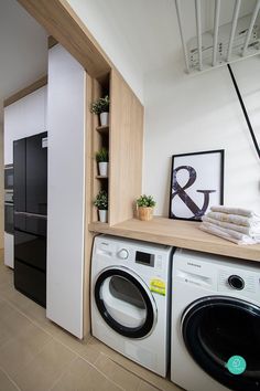 a washer and dryer in a small room