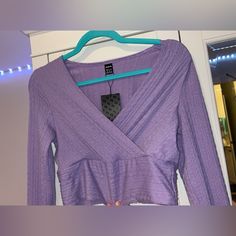 Never Worn Ribbed Long Sleeve Party Top, Purple Long Sleeve Tops For Night Out, V-neck Knit Top For Spring Night Out, Casual V-neck Knit Top For Party, Spring Ribbed Purple Sweater, Purple Knit Tops For Layering, Purple Knit Top For Spring, Knit V-neck Tops For Night Out, Ribbed V-neck Top For Parties