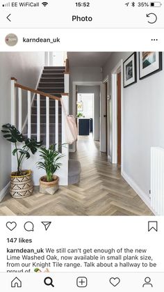 the inside of a house with stairs and pictures on the walls, in an instagram