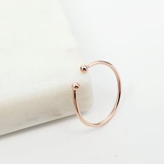 Hand crafted from solid gold, these open stacking rings are a beautiful addition to any collection. Every ring is unique and each ball end is shaped down by hand from 18 gauge gold wire. The open ended design also allows for a flexible & perfect fit for everyone. D E T A I L S : 10k Solid Gold Cuff Ring  Metal: Solid Gold  Karat/purity: 10k Sizes: All Sizes Available Ring Thickness: approx. 1.00mm WHY YOU'LL LOVE IT : Flexible fit Dainty and minimalist Crafted in 10k solid gold  Handmade HOW IT' Gold Cuff Ring, Open Cuff Ring, Cuff Ring, Cuff Rings, Gold Cuffs, Ring Minimalist, White Gold Band, Stackable Ring, Delicate Rings