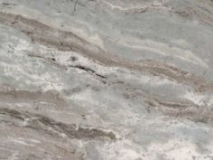 a marble counter top with white and brown colors