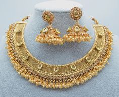 Kundan Gold Necklace Set/Jhumki Set/Pearl Cluster Necklace/Brass Gold Kundan Jewelry Set/Bridal Jewelry Set For Wedding/Gift For Bridesmaid  A premium quality Kundan gold pearl cluster necklace set with jhumki. Embrace the festive seasons with this timeless set. Cluster of pearls with gold combination has been the most popular design.  Necklace can be adjusted with doori Jhumki length: Approx. 2". Earrings Push-back closure. 1GM gold plated on high-quality brass as base metal. *Color may vary sl Cheap Gold Kundan Necklace, Luxury Kundan Necklace In Yellow Gold For Wedding, Traditional Gold Kundan Necklace, Luxury Yellow Gold Kundan Necklace For Reception, Luxury Yellow Gold Temple Jewelry Kundan Necklace, Luxury Gold Fusion Jewelry Sets, Luxury Festive Yellow Gold Kundan Necklace, Luxury Gold Kundan Necklace For Eid, Luxury Gold Plated Kundan Necklace