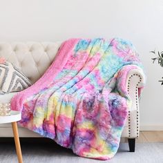 a couch with a colorful blanket on it