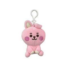 a pink stuffed animal keychain with a bunny on it's face and ears