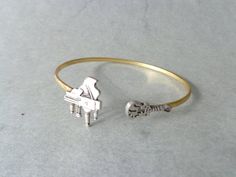 piano guitar music bracelet Affordable White Music-themed Jewelry, Silver Band Jewelry For Concert, Silver Band Jewelry For Concerts, Music-themed Band Jewelry As Gift, Music-themed Band Jewelry Gift, Silver Band Bracelets For Concerts, Silver Bracelet Jewelry For Concert, Silver Bracelet For Concerts, Music-themed Bracelet Jewelry Gift