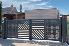 the gate is made of metal and has geometric designs