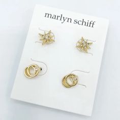 *Color: Yellow Gold *Product Details: Maryln Schiff Stud Earring Set. 2 Pairs. Yellow Gold-Plated. White/Colorless Stone Color. 1 Set Of Starburst Stud Earrings. 1 Pair Of Double-Ring W/ A Cubic Zirconia Crystal Earring Set. Rubber Round Back Closure. *Condition: Nwt. Original Packaging/Unused. Shell-shaped Yellow Gold Earrings For Gifts, Gold Ocean-inspired Shell Drop Earrings, Yellow Gold Shell-shaped Earrings, Double Ring, Stud Earrings Set, Crystal Earrings, Stone Color, Cubic Zirconia, Earring Set