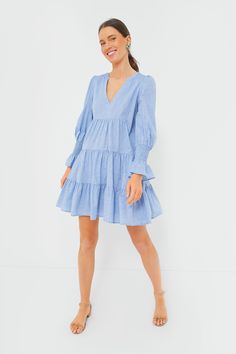 A customer favorite and all time best-seller, the Kenzo Dress is back and better than ever in a classic chambray colorway. Featuring a flattering V-neckline, feminine flutter sleeves, and loose empire waist, this flirty frock is the most flattering day dress. Pair with flats and your favorite headband for a casual day look or dress up with heels and statement earrings for dinner with friends. V-neckline Long sleeves Elasticated ruffle cuffs Empire waist Tiered skirt Chambray fabric Mini length M Flowy V-neck Tiered Dress For Spring, V-neck Dress With Smocked Back For Brunch, Spring V-neck Dress With Ruffle Sleeves For Brunch, Summer V-neck Tiered Dress For Daywear, V-neck Tiered Dress With Ruffle Hem For Day Out, Summer Puff Sleeve V-neck Dress With Ruffle Hem, Spring V-neck Dress With Smocked Back, Casual V-neck Dress With Gathered Sleeves, Chic V-neck Dress With Ruffle Hem For Day Out