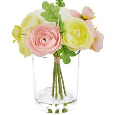 a glass vase filled with pink and yellow flowers