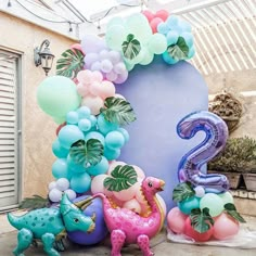 balloons are arranged in the shape of numbers and dinosaurs