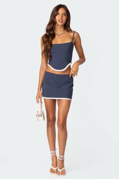 Mini skirt Seam detailing Contrast eyelet trim Zip back closure Matching set Polyester, Spandex Model wears size S Model height is 5'7 Item care: Wash with similar color Visionary Fashion, Fabric Matching, Lace Up Corset, Boned Bodice, Corset Lace, Swimwear Dress, T B, Navy Tops, Corset Top