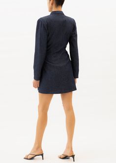 This Mini Dress features a dark denim fabric, v-neckline, and wrap dress style for an eye-catching look. This sophisticated design is an ideal choice for any special event or evening outing. Our pieces are majority made to order ensuring that no fabric is wasted and energy is conserved. Once the order is placed we will notify you when it has been made and is shipped out (Approximately 2-3 weeks). Customizations Dark Wash Cotton Mini Denim Dress, Spring Button-up Dark Wash Mini Dress, Dark Wash Fitted Button-up Denim Dress, Dark Wash Button-up Denim Dress, Dark Wash Button-up Mini Dress With Button Closure, Wrap Dress Styles, Mini Wrap Dress, Sleek Look, Dark Denim