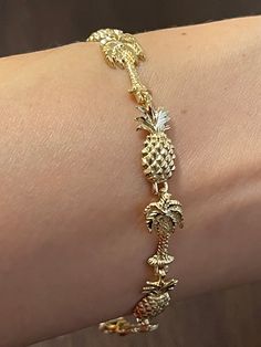 Elegant And Beautiful Hawaiian 14K Solid Yellow Gold 8mm Palm Tree & Pineapple Diamond Cut Bracelet 7 Inches 14 Karat Solid Yellow Gold GUARANTEED, Authenticated with a 14K Stamp Made With Highest Quality Craftsmanship Solid 14K Yellow Gold Pineapple And Palm Tree Diamond Cut Bracelet Total Weight 8.3 grams Solid 14K Yellow Gold Pineapple Width 8 Millimeters Length 17 Millimeters Solid 14K Yellow Gold Palm Tree Width 8 Millimeters Length 17 Millimeters Solid 14K Yellow Gold Pineapple And Palm Tr Hand-set 22k Yellow Gold Bracelets, Hawaiian Gold Bracelet, Pineapple Island Jewellery, Palm Tree Jewelry, Pineapple Bracelet, Pineapple Necklace, Gold Pineapple, Jewerly Designs, Fine Silver Jewelry