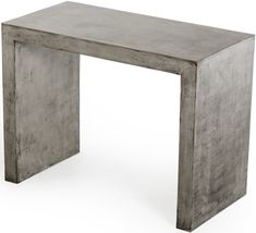 a concrete table sitting on top of a white floor