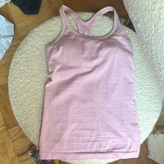 Lululemon Never Worn With No Tags Ebb To Street Tank In Pink, Size 4, Built In Bra Fits B-C Cup Lulu Shirts, Fitted Pink Go-dry Tank Top, Pink Fitted Go-dry Tank Top, Lululemon Clothes, Pink Racerback Tank Top For Pilates, Lululemon Ebb To Street Tank Top, Ebb To Street Tank, Fitted Pink Breathable Tank Top, Lulu Ebb To Street Tank