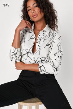 Take workday chic to a new level with the Lulus Artistically Chic Ivory and Black Abstract Print Button-Up Top! Lightweight woven fabric, with a minimalist abstract print throughout, shapes long sleeves with button cuffs and a collared neckline. Bodice has a functional button placket at front, atop rounded hems. Fit: This garment fits true to size. Length: Size medium measures 26.50" from shoulder to hem. Bust: Great for any cup size. Waist: Not Fitted - comfortable room throughout midsection. U White Floral Print Office Blouse, White Floral Print Blouse For Office, Casual Workwear Blouse With Abstract Print, Trendy Abstract Print Tops For Work, Chic Printed Blouse For Workwear, White Printed Blouse For Work, Chic Abstract Print Tops For Work, Chic Abstract Print Top For Workwear, Chic Tops With Abstract Print For Work