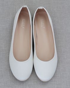 Contemporary and refined designed ballet inspired wedding flats. This smooth satin round toe flat brings comfortable simplicity and elegance to your wedding ceremony and/or reception, bridal party, date night, or everyday fancy wear. Available in 9 colorsDETAILS:COLORS AVAILABLE: Black, Burgundy, Champagne, Dusty Pink, Hunter Green, Ivory, Light Blue, Navy, and WhiteUPPER: Synthetic upper and liningMATERIALS: Manmade outsole STYLE: CASSIE Shoes For Prom Flat, Flat White Shoes, Comfortable Wedding Flats, Ivory Ballet Flats, Elegant Shoes Flat, Homecoming Shoes, White Flat Shoes, Fancy Flats, Perfect Wedding Shoes