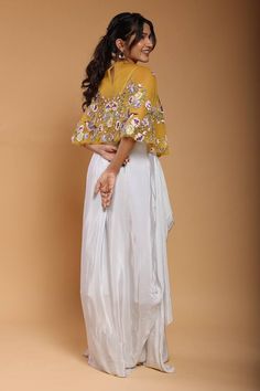 Yellow cape featuring floral embroidery all over. Paired with a powder blue draped harem pant and a tube top. - Aza Fashions Floral Cape, Mithila Palkar, Embroidered Cape, Blue Drapes, Adah Sharma, Diana Penty, Harem Pant, Kareena Kapoor Khan, Luxury Sale