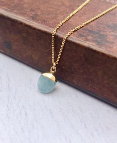 Aquamarine Necklace, March Birthstone, Minimalist Oval Pendant, Blue Aquamarine Jewelry, Layering Gold Necklace, Birthday Gift for March This simple dainty necklace features a tiny genuine aquamarine pendant dipped in your choice of 14k Gold Filled or Sterling Silver. The aquamarine pendant is suspended from a delicate cable chain in the finish of your choice. This is a 100% natural gemstone, full of healing properties. This necklace is simply perfect for everyday wear and is perfect for layerin Blue Oval Pendant Necklace In Dainty Style, Blue Dainty Oval Pendant Necklace, Blue Birthstone Necklace With Oval Pendant, Dainty Blue Oval Necklace, Blue Oval Pendant Necklace With Birthstone, Dainty Blue Oval Pendant Necklace, Elegant Oval Aquamarine Necklaces, Minimalist Aquamarine Jewelry Gift, Oval Aquamarine Necklace