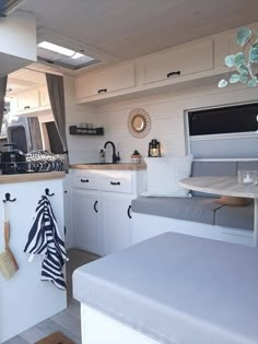 the kitchen is clean and ready to be used as a living room or dining area