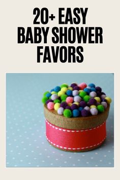 the words 20 easy baby shower favors on top of a cupcake covered in candy