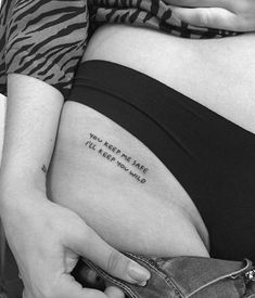 a pregnant woman's belly with the words you keep me safe written on it