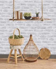 a white brick wall with shelves and plants on it in front of a wooden floor