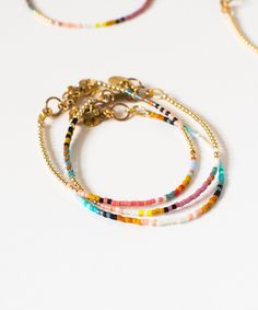 Inspired by vintage serape blankets, this intricately patterned seed bead bracelet is a fun addition to your arm party!  Easy on / off snap-clasp closure Adjustable – 6.5 to 7.25" Brass findings Water-resistant, store in a dry environment Handmade in Athens, GA Heishi Beaded Chain Bracelet Jewelry, Heishi Bead Bracelet With Beaded Chain, Adjustable Beaded Chain Bracelets For Festivals, Colorful Bohemian Friendship Bracelets With Heishi Beads, Colorful Bohemian Heishi Beads Friendship Bracelets, Bohemian Multicolor Heishi Beads Bracelets, Bohemian Style Heishi Beads Bracelets With Tiny Beads, Bohemian Heishi Beads Bracelets With Tiny Beads, Multicolor Beaded Chain Bracelets For Festival