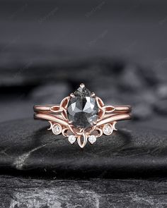 an engagement ring with a black diamond in the center