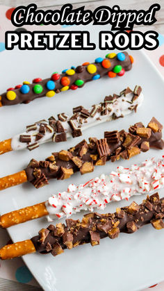 chocolate dipped pretzel rods on a white plate