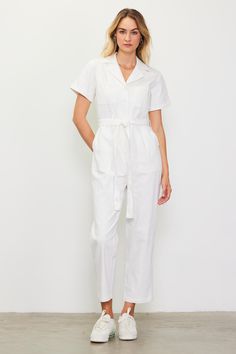 Washed down for a faded character, this straight-leg jumpsuit has cuffed short sleeves, utility-inspired pockets, and a removable tie belt to define the waist. Cropped to the perfect ankle length, it's an effortless one-and-done outfit. •Notched collar •Button placket •Cuffed short sleeves •Utility pockets •Optional self-tie belt Item Number: 73412 Utility Jumpsuit, Utility Pockets, Belt Tying, White Jumpsuit, Cuffed Shorts, Notched Collar, Tie Belt, Button Placket, Item Number