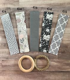 four pieces of fabric and some scissors on a wooden surface with measurements for each piece