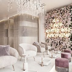 a room filled with lots of white furniture and chandelier hanging from the ceiling