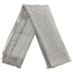 LOUIS VUITTON scarf comes in white & grey stripe cotton / silk with a fringe trim. Made in Italy. Very Good Pre-Owned Condition. Measurements: 74 inches x 27 inches Reference: 120137 Category: Scarves More Details Brand: LOUIS VUITTON Color: White Color 2: Grey Pattern: Stripe Fabric: Cotton / Silk Age Group: Adult Gender: Male Made in: Italy Louis Vuitton Scarf Silk 90*180 Black And White, Louis Vuitton White, Louis Vuitton Scarf, Stripe Fabric, Grey Pattern, Striped Fabrics, Fringe Trim, Grey Stripes, Cotton Silk