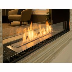 a modern fireplace with flames burning in it