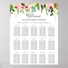 the wedding seating chart is shown with flowers and greenery on it, as well as two