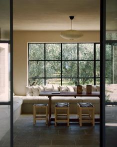 a living room filled with furniture next to a window